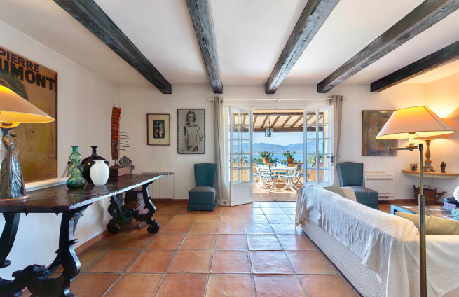 bright living room with fireplace and sea view