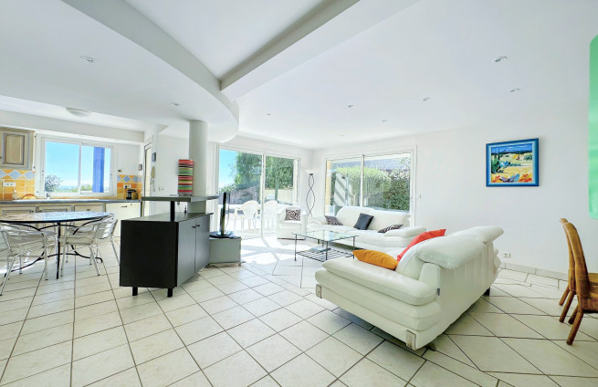 living room with fireplace and view of Cavalaire harbor