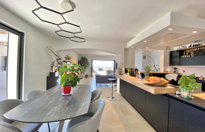 Bright dining room with access to terrace and pool in a villa in Sainte-Maxime